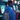 Person wearing a blue hoodie with a graphic design in an arcade setting