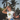 Streetwear photo of a woman wearing a Hashies ramen crop top with ripped jeans under palm trees – perfect for summer collections and wellness branding.
