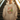 Person wearing an Ivory hoodie with a colourful graphic Hashies Ramen design as she stands in front of a staircase