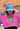 The Hashies Raccoon Collection features a stylish pink crop top hoodie with a playful raccoon-themed Hashies design, paired with a premium embroidered blue cap. Perfect for streetwear and casual fashion.