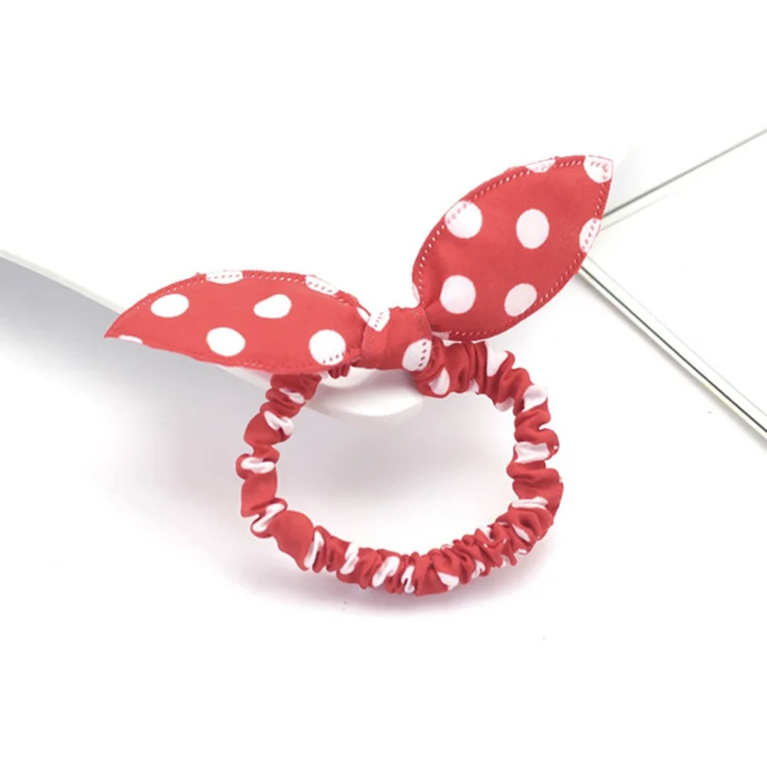 The image portrays a vibrant red bunny ear headband with white polka dots, perfect for adding a pop of color and playful charm to Hashies or as an energetic accessory for desk pets