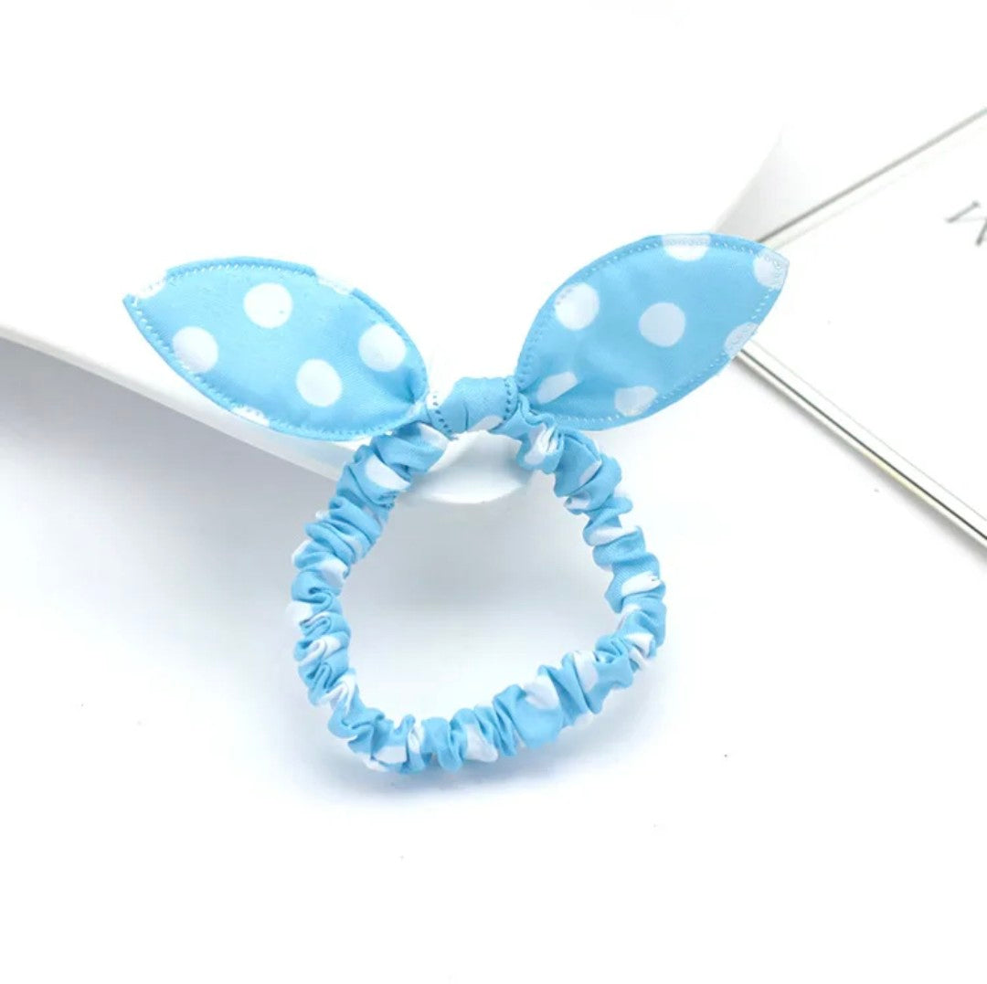 The image features a sky blue bunny ear headband dotted with white polka dots, an accessory that exudes calm and charm for Hashies or as a refreshing addition for desk pets.