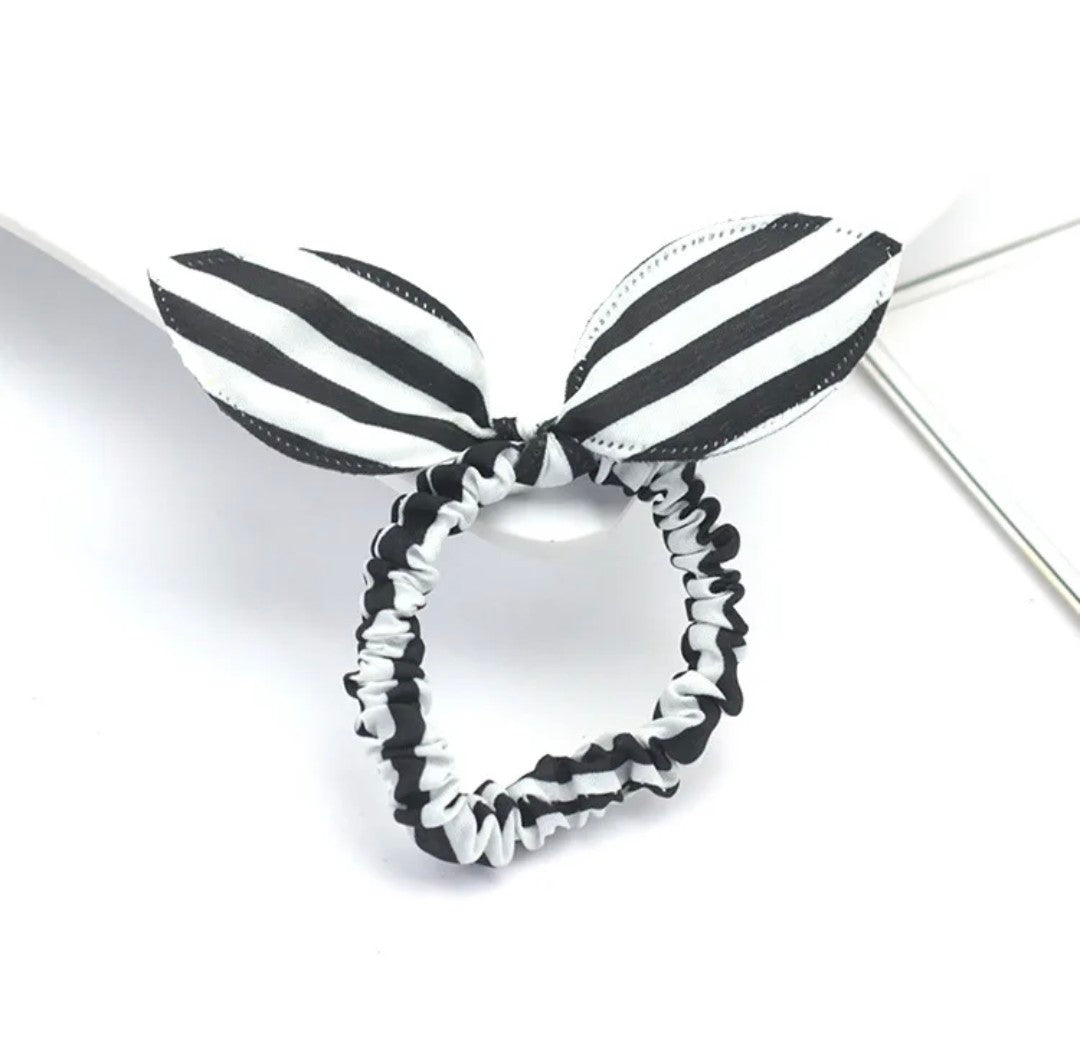 The image displays a striking black and white striped bunny ear headband, an accessory that offers a bold and classic look for Hashies or as a statement piece for desk pets.